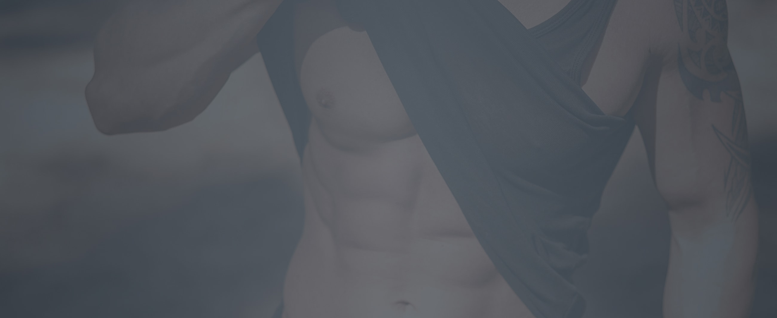 Gainesville, FL male tummy tuck model in tank top showing toned physique.