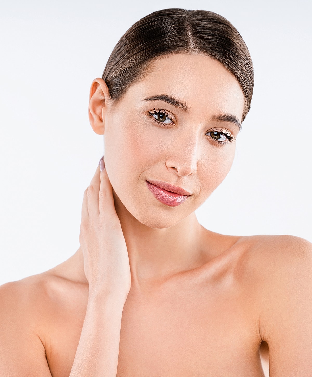 Smiling woman touching her neck gently