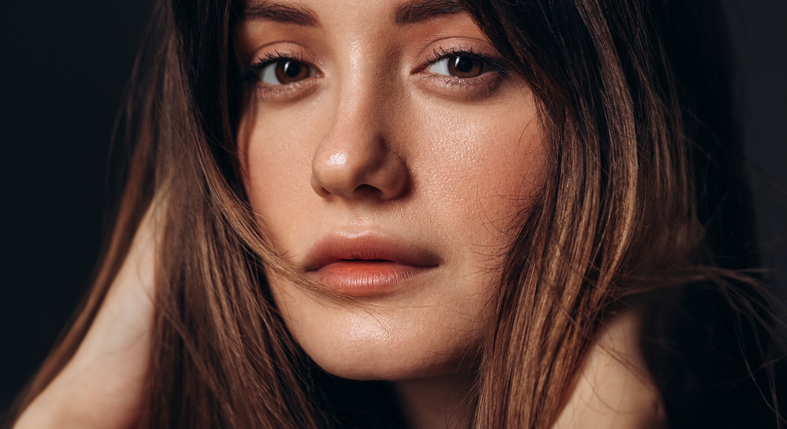 Gainesville, FL blepharoplasty model with flowing hair.